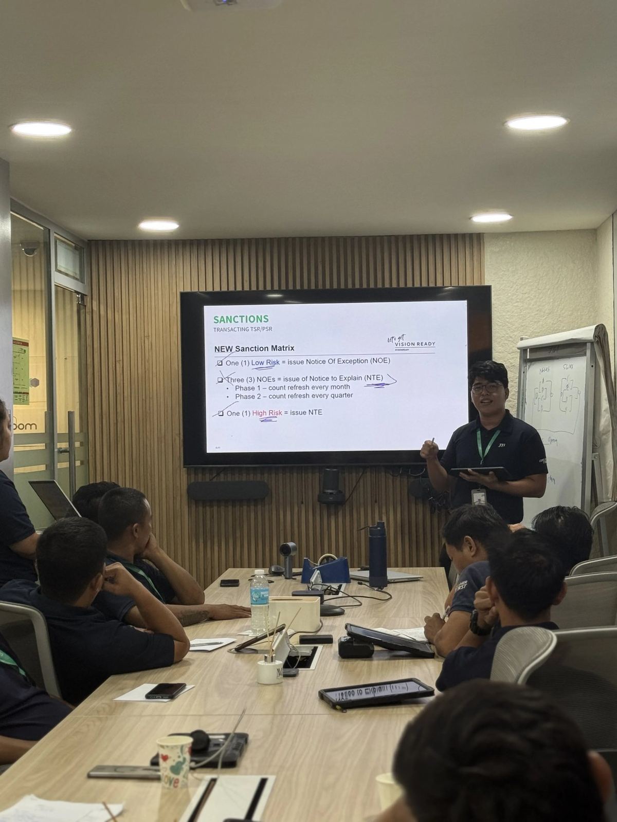 Mark Anthony Gabo presenting at an office meeting