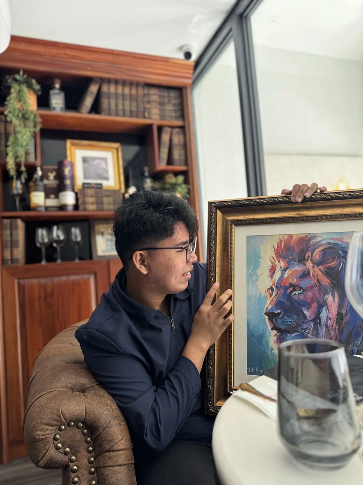 Mark Anthony Gabo admiring a painting